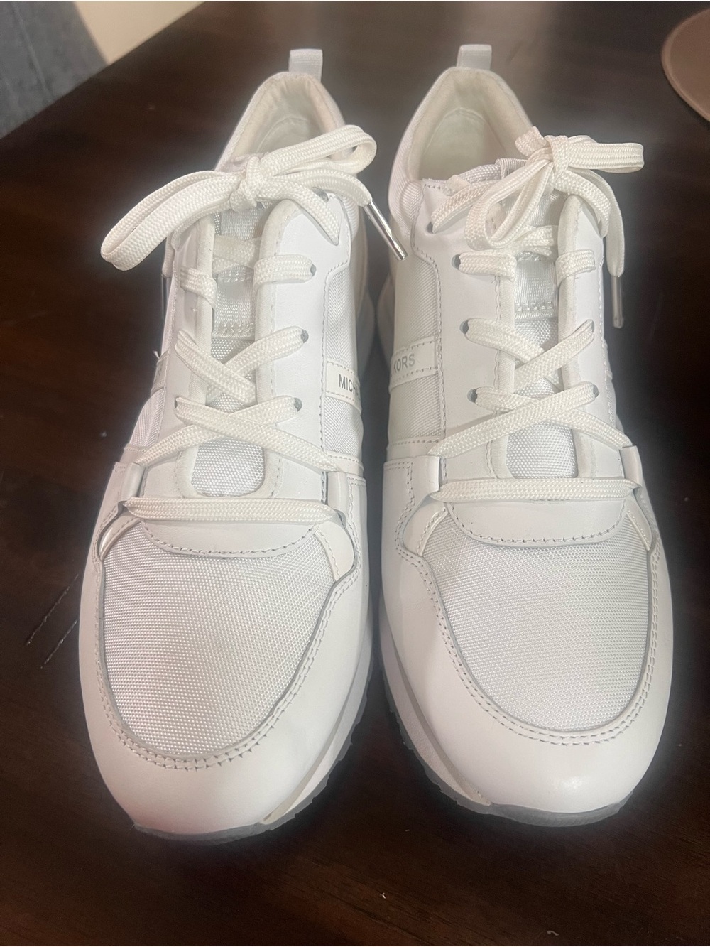 Michael Kor’s White MK with Silver  accents Sneaker